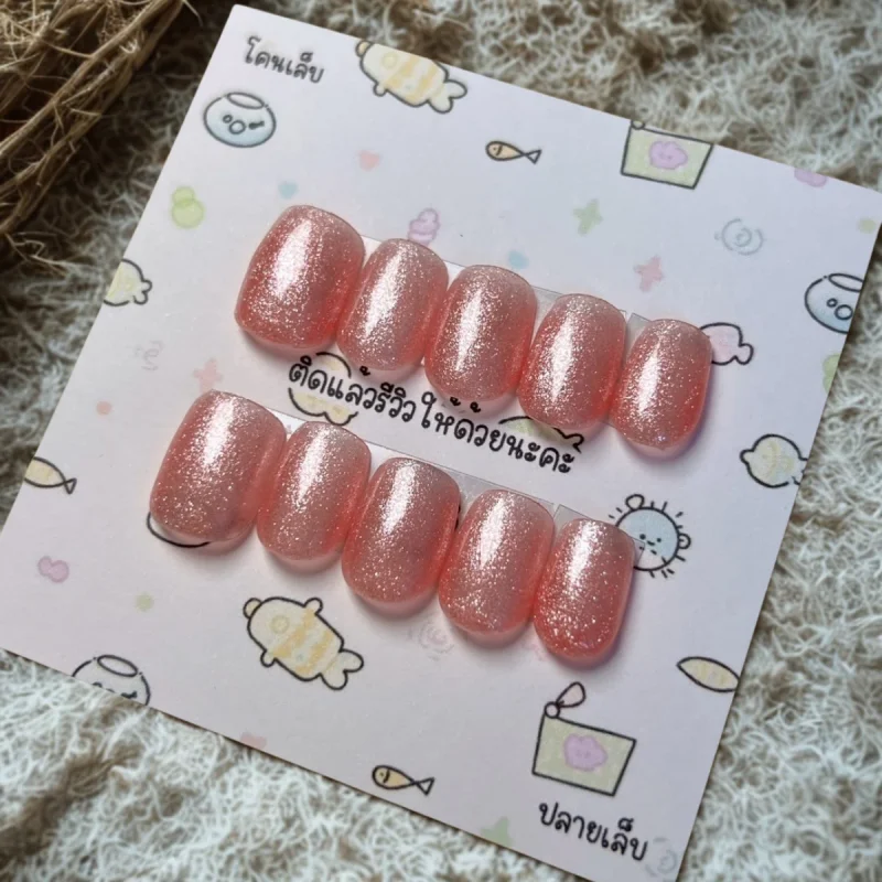 เล็บทรงสควอวลสีพีชกลิตเตอร์เจล (Peach Glitter Gel Squoval)